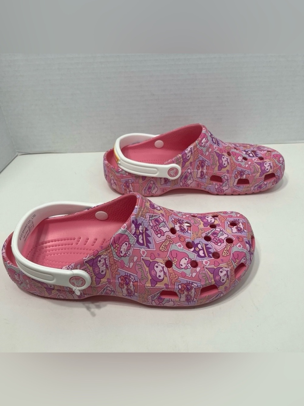 CROCS Hello Kitty pink clogs shoes Women’s size 12 or men’s size 10 NWOT unisex